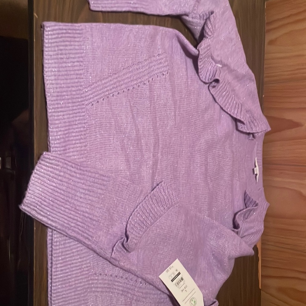 Large women’s purple with sparkles sweater. Brand new.